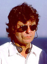 A man with sunglasses and headphones on.