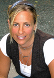 A woman with blonde hair and a white shirt.
