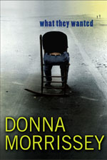 A person sitting in a chair on the side of a road.