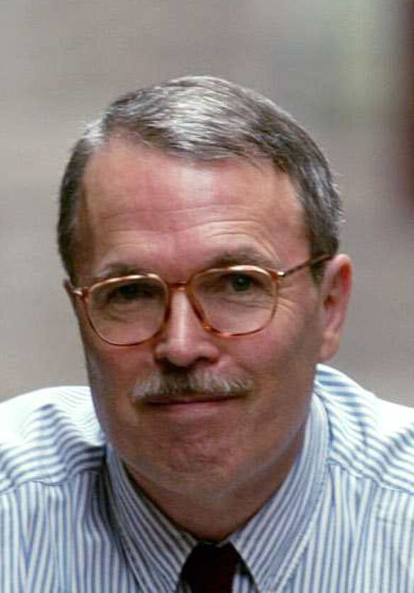 A man with glasses and a mustache.